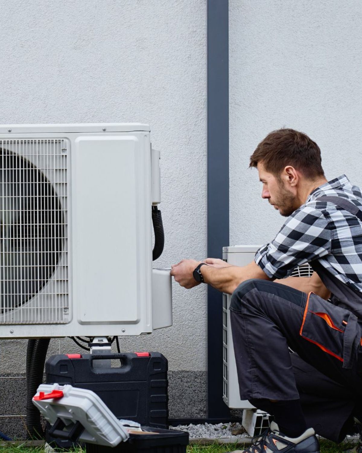 Gulf Coast Cooling technician servicing an AC unit